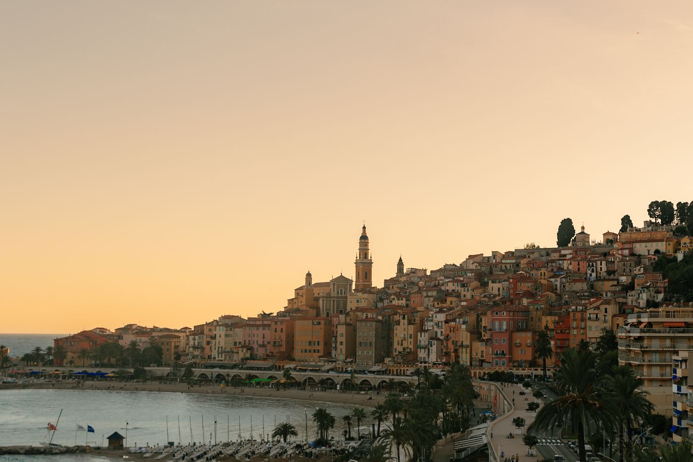 The old town of Menton above its bay in the last light of the day.